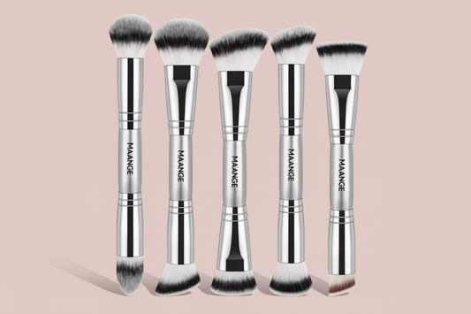 Five silver MAANGE brushes standing - pink background