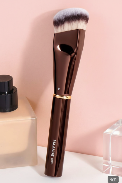 MAANGE foundation brush with pump bottle on soft pink background