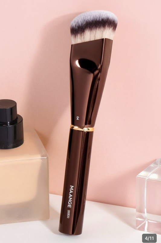 MAANGE foundation brush with pump bottle on soft pink background