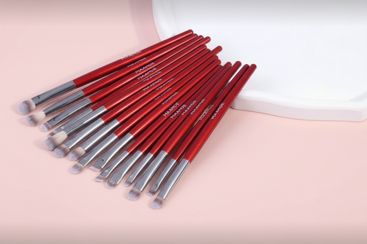 Red MAANGE brushes fan layout - soft pink background